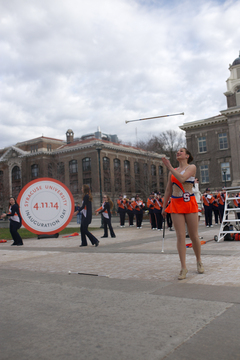 Baton twirler, Meghan Sinisi, performs during the inauguration ceremony in the quad on April 11, 2014.