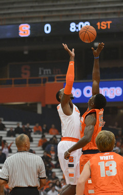 Rakeem Christmas (left) and Chinonso Obokoh (right) go up for the jump ball to start the men's basketball scrimmage. 