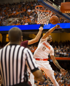 Michael Gbinije goes after a loose ball at the rim. The junior had seven first-half points on 3-of-7 shooting.