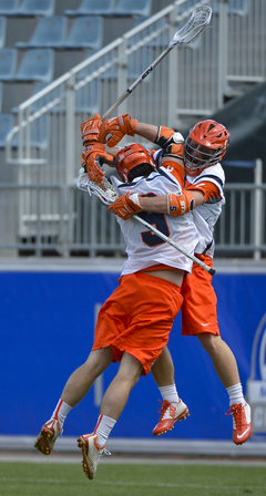 SU midfielder Tim Barber (9) and attack Kevin Rice (2) embrace during the Orange's victory.