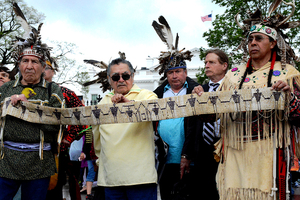 Petitioners hold a Wampum belt, which signifies a promise made in the late 1700's that the Onondaga Nation would have access to the court system.
