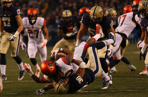 SU running back Prince-Tyson Gulley is dragged down by Pittsburgh defensive back Ryan Lewis.