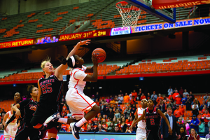 Alexis Peterson goes up for a layup against North Carolina State on Sunday. The point guard finished with 27 points and guided SU in a 23-0 second-half run.