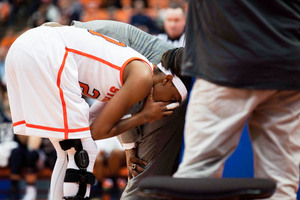 Syracuse's Brittney Sykes, pictured after re-injuring herself during SU's loss to Notre Dame on Jan. 4, has begun the rehab process all over again. She discussed it Wednesday morning with reporters. 