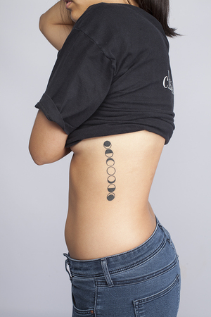 Beaux Wongwaisayawan's ribcage tattoo is in remembrance of her grandfather who passed away on Jan. 7, 2010.  Any time she looks up at the moon now, she is reminded of her grandfather, she said.
