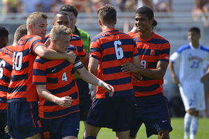 Syracuse celebrates Liam Callahan's (4) first collegiate goal. Two Orange midfielders and two forwards accounted for SU's scoring.