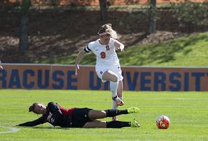 Jackie Firenze loses the ball on a slide tackle by a Cornell defender. The Orange fell behind early in the first half and didn't make up the one-goal deficit.