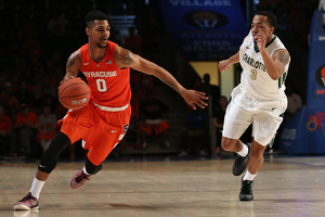 Syracuse point guard Michael Gbinije scored 26 points in Syracuse's win on the first day of the Battle 4 Atlantis. See what our beat writers think will happen on the second day. 