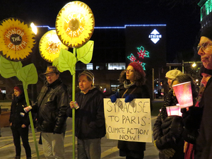 Syracuse community members gathered in Perseverance Park located in downtown Syracuse on Monday for a peace vigil about climate change. The vigil was part of more than 2,000 events that took place worldwide to support the UN Climate Talks in Paris.