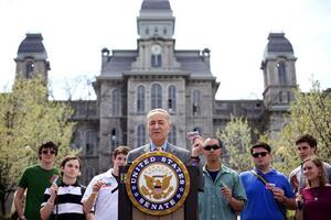 Sen. Charles Schumer discusses student loans in front of the Hall of Languages. This week, a Syracuse man announced he will run against him.