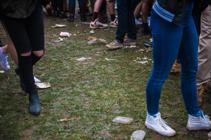 Cups, lids and food all litter the ground at Mayfest.