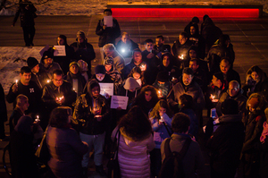 Community members gather outside Hendricks Chapel for a vigil held in solidarity with the people of Aleppo, Syria. The vigil was also a protest, with the group calling for a ceasefire and the delivery of aid to people in the city.