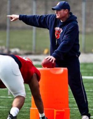 Scott Shafer leads a drill during football practice. Shafer, the new defensive coordinator at Syracuse, helped improve two of the last three defenses he's coached.