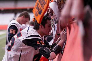 Staats signs an autograph after SU's win.