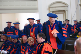 Audience in members in academic regalia file in to seats in Hendricks Chapel during Chancellor Kent Syverud's inauguration on April 11, 2014.
