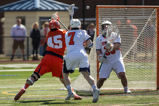 Orange attack Randy Staats gets off a shot from the left doorstep.