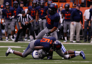 Desir makes a tackle on a Duke player. 