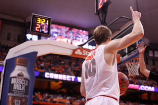SU guard Trevor Cooney calls a play as he prepares to throw an inbounds pass from the baseline.