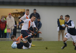 The Orange's Alex Halis looks to chase a loose ball, as does PSU's Brian James.