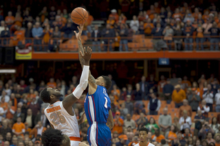 Rakeem Christmas jumps up for the opening tipoff against Louisiana Tech's Michale Kyser.