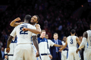 Villanova players celebrate after their overtime win against Syracuse. The victory moved the Wildcats to 11-0 on the season. 