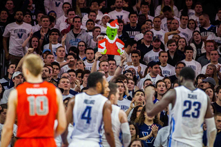 The Villanova student section holds up a picture of Jim Boeheim dressed as the Grinch.