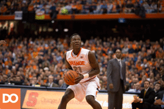 Syracuse forward Tyler Roberson flushes home an uncontested dunk.