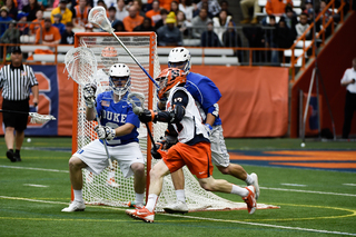 Donahue cuts around the cage against a Duke defender. The junior tied for the team lead with seven points.