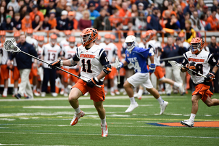 Defender Brandon Mullins charges up the field. He, along with the rest of the SU defense, limited Duke to only seven goals.