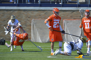 SU's Ralph D'Agostino falls to the ground after colliding with Notre Dame's Sergio Perkovic