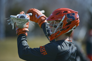 Syracuse's Jay McDermott holds a ball in his stick prior to the Orange's game against Notre Dame.