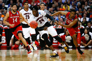 The Cardinal's Montrezl Harrell (24) goes after a loose ball while NCSU's Ralston Turner (22) gives chase.