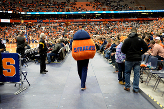 Otto walks through the crowd at the Carrier Dome during the last home men's basketball game on Monday night.