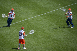 The Orange's goalies toss a ball around during warm-ups.