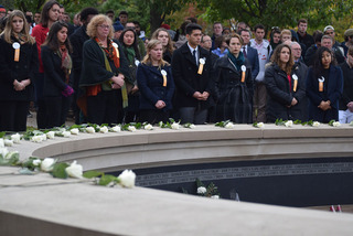 Additional members of the SU community placed roses at the end of the ceremony. 